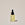 A clear glass bottle with a dropper containing organic 'Argan Oil ', labeled ACURE on a neutral background.